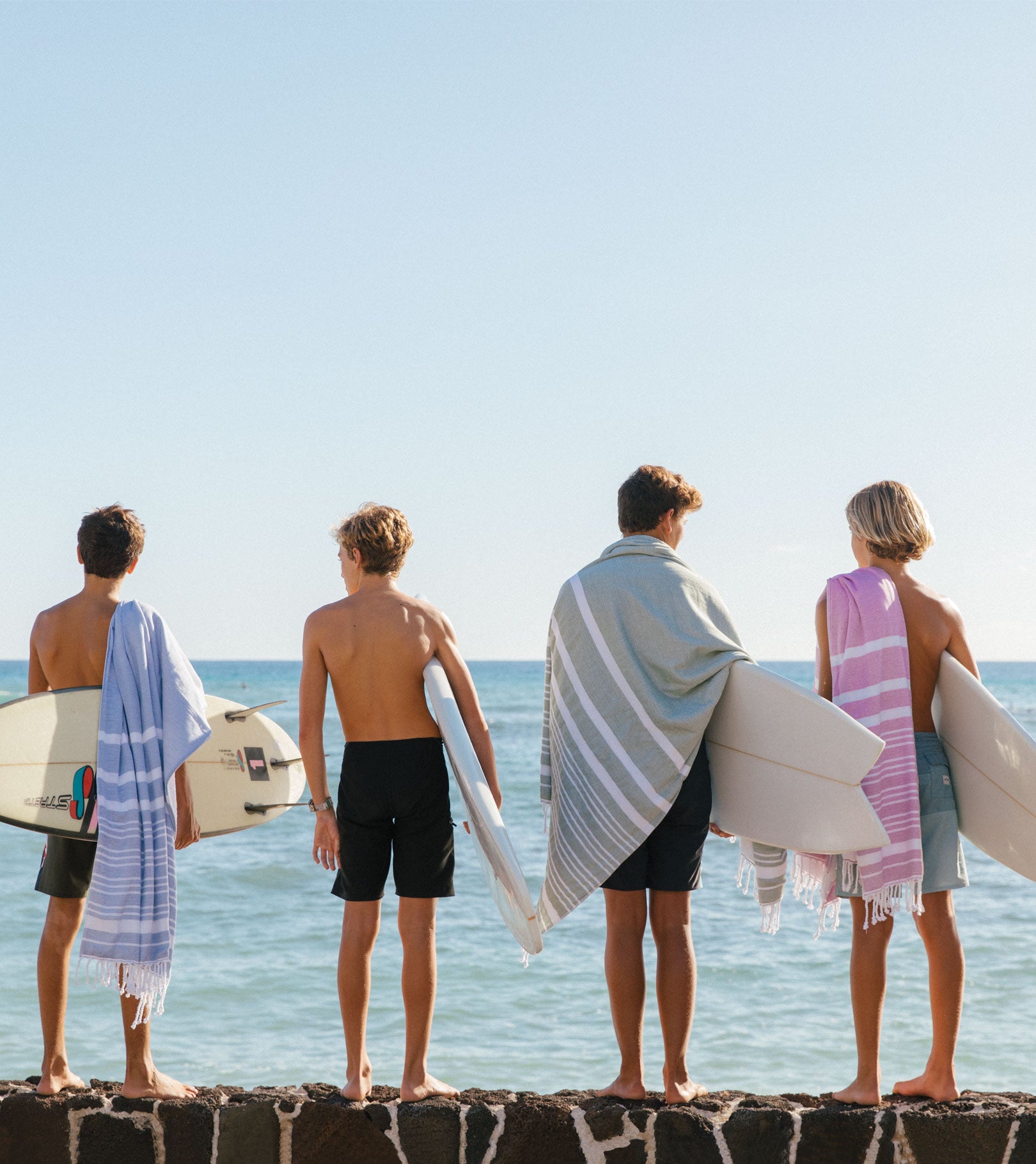 Averylily Swim, Surf + Sand Fouta Beach Towels in Ocean Blue, Orchid Pink, and Palm Green.