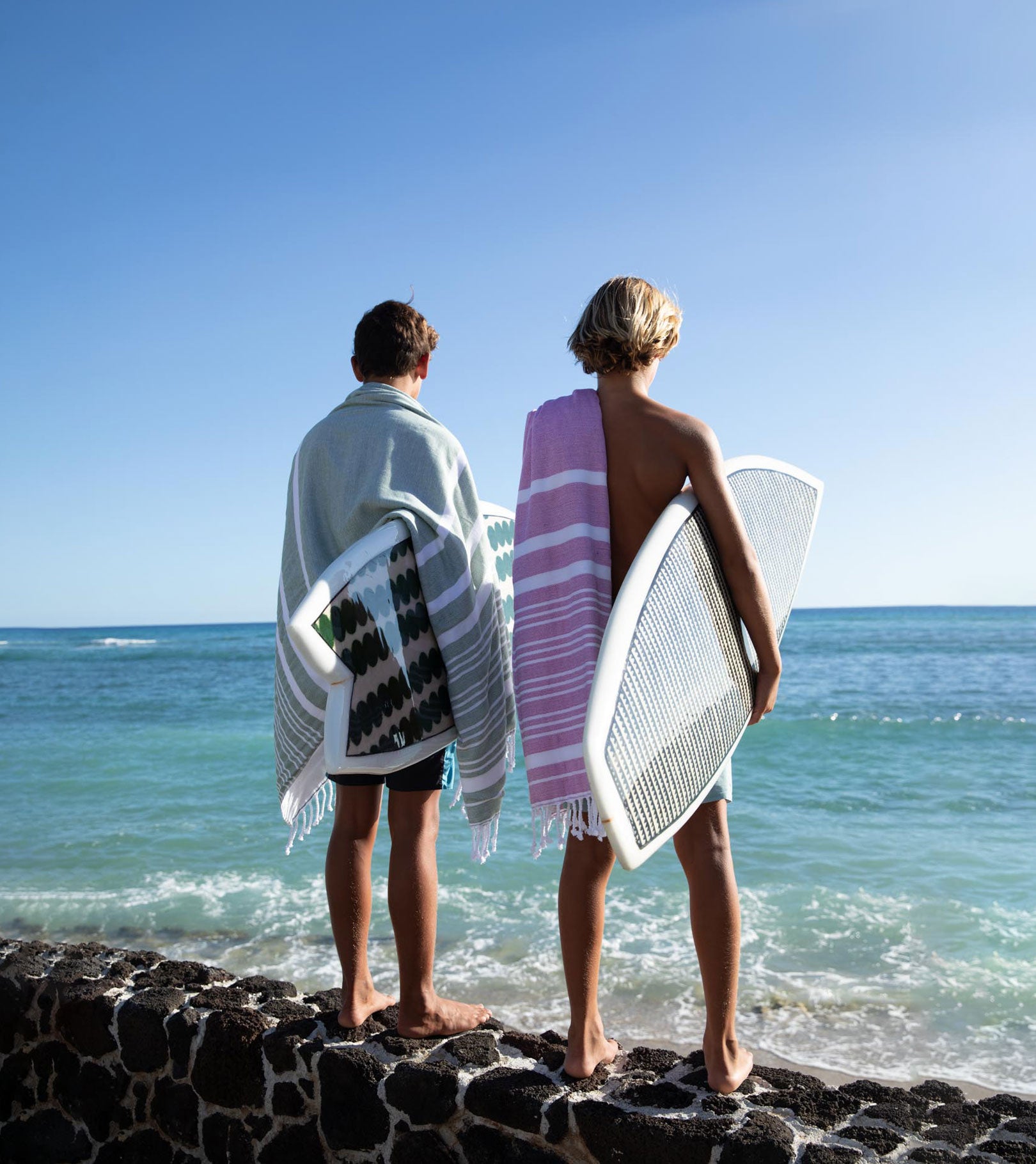 Averylily Swim, Surf + Sand Fouta Beach Towels in Orchid Pink and Palm Green.