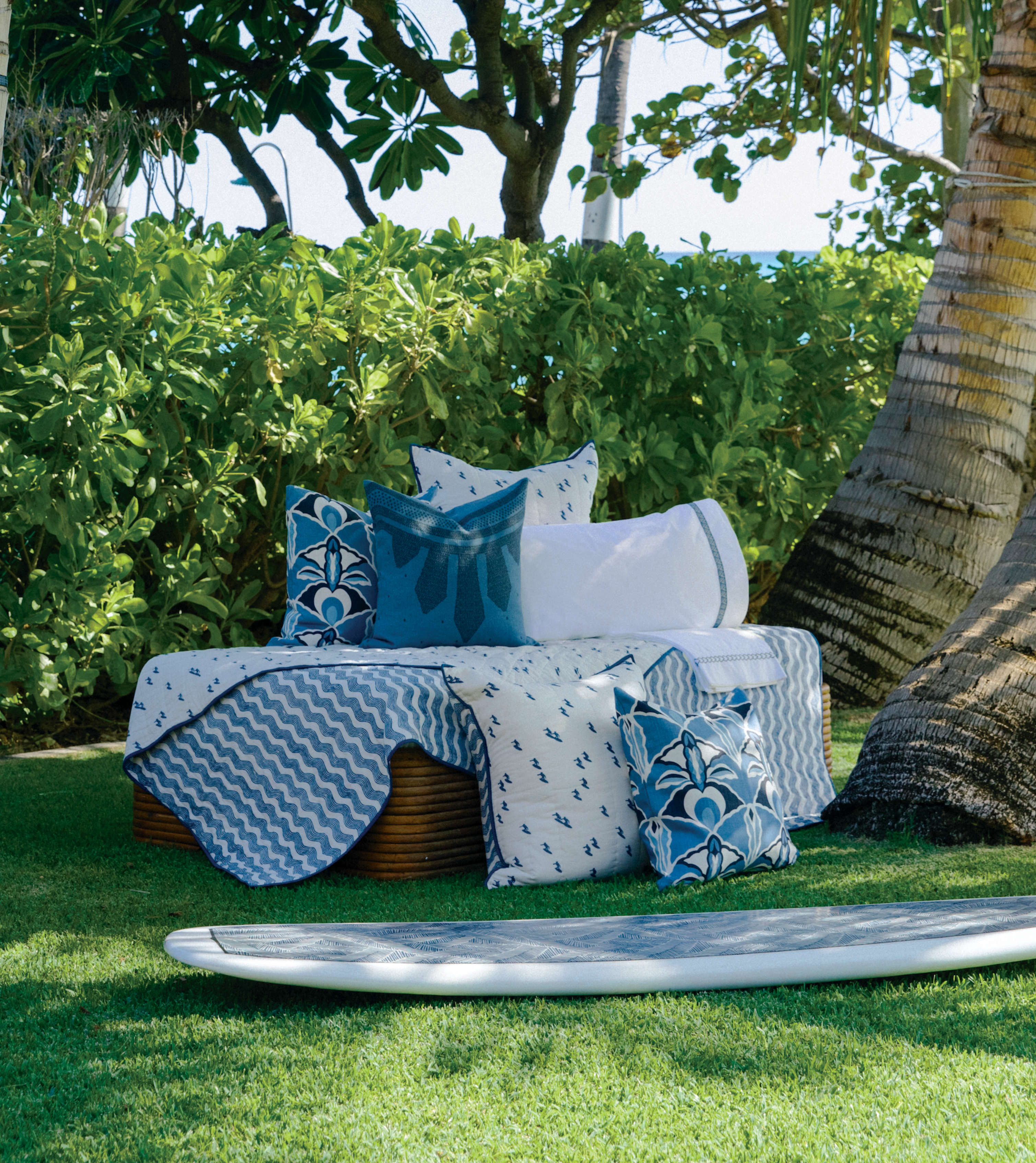 Andrew Mau x Averylily Surfer Blockprint Quilt and Euro Shams in Ocean Blue, styled with Serena Dugan Studio pillows.