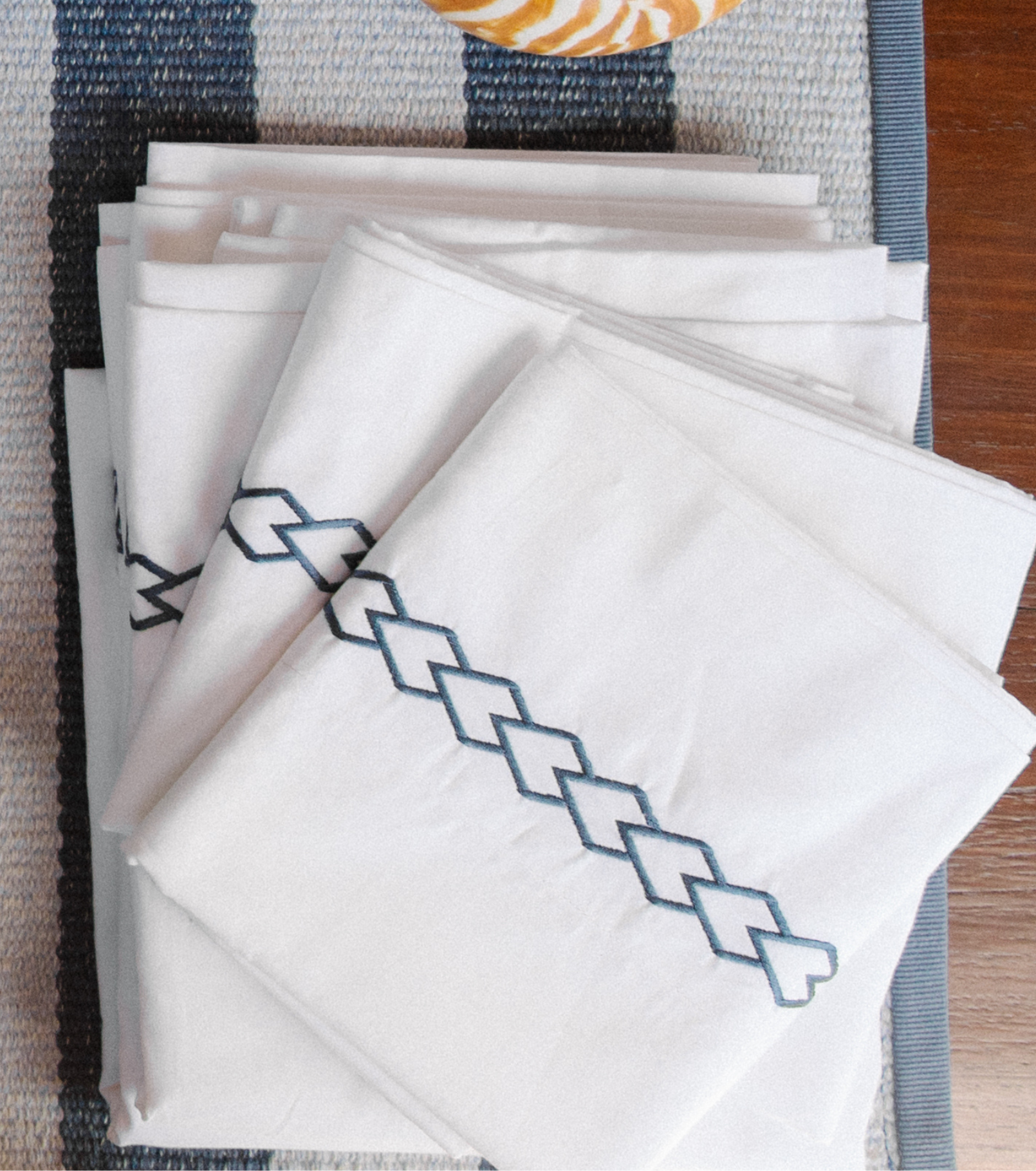 Averylily Waterfall Sheet Set in White with embroidered details in Ocean Blue. 510-thread cotton pure cotton percale.