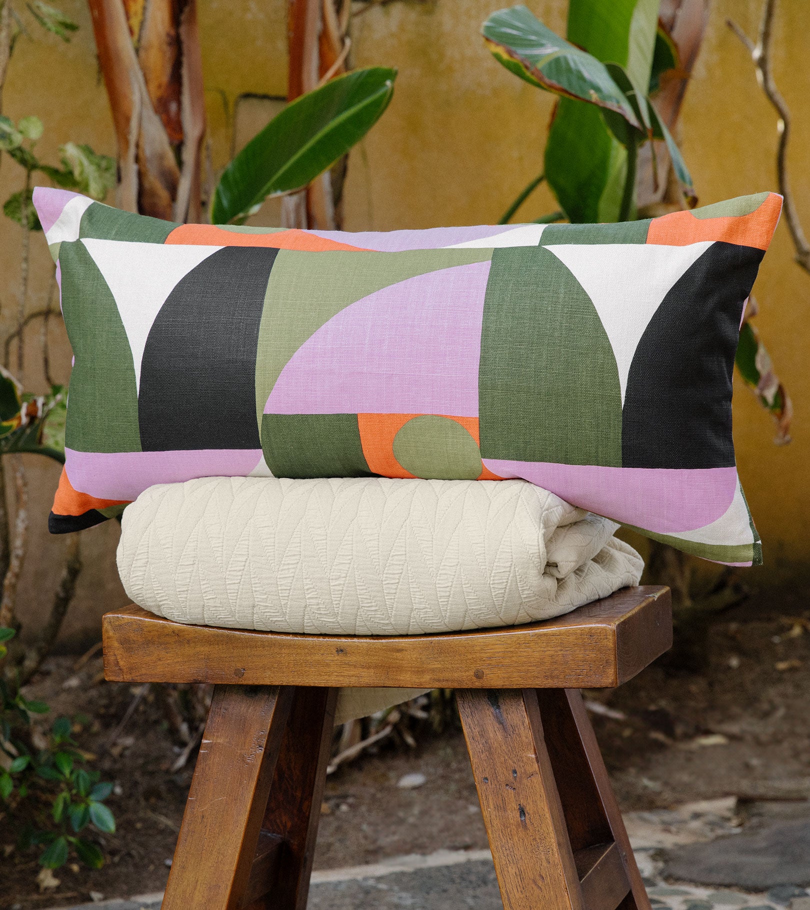 Averylily pure cotton matelassé coverlets in Sand. Styled beneath a Serena Dugan Studio decorative pillow.