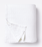 Averylily pure cotton matelassé coverlet. Each coverlet features a herringbone design that is unique to Averylily. Shown here in White Cloud.