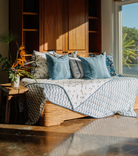 Andrew Mau x Averylily Surfer Blockprint Quilt in Ocean Blue, styled with Serena Dugan Studio pillows.