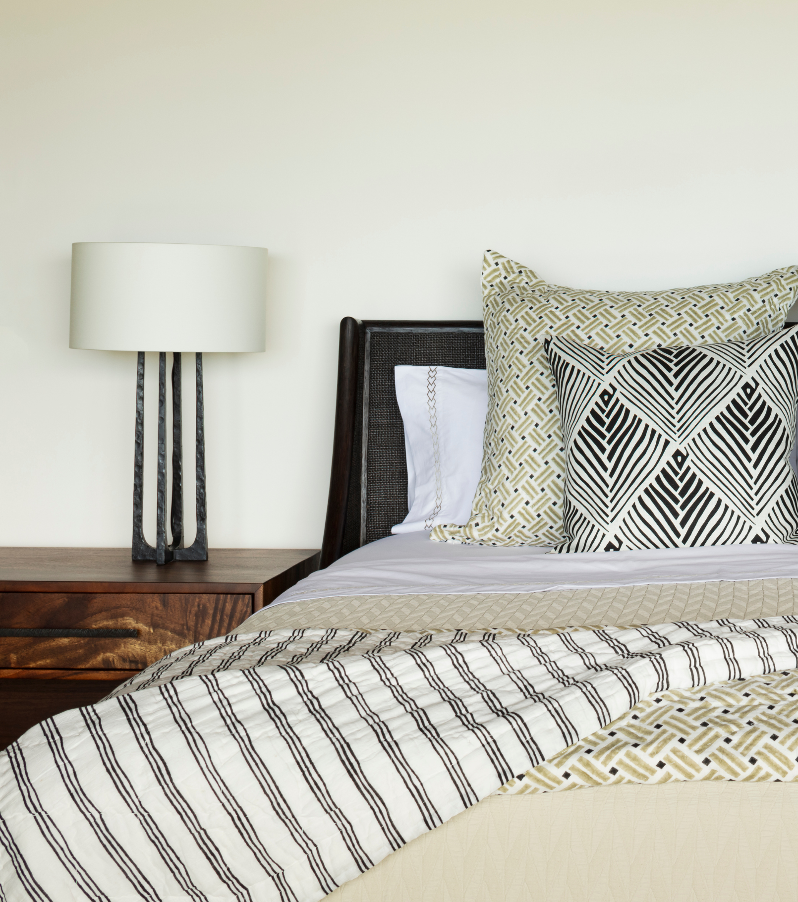 Averylily pure cotton matelassé coverlet in Sand. Styled with Averylily Big Island Bedding in Sand & Basalt, Watermark Sheeting in Sand, and Serena Dugan Studio decorative pillow.