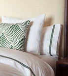 Averylily Weave Duvet Cover in White with embroidered trim in Palm Green. 510-thread count cotton percale. Styled with Serena Dugan Studio decorative pillow.