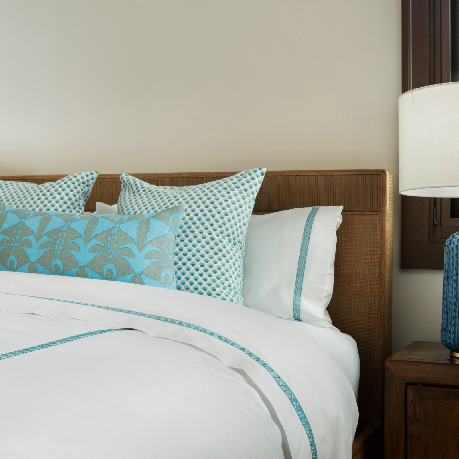 Averylily Weave Duvet Cover in White with embroidered trim in Sky Blue. 510-thread count cotton percale. Styled with Serena Dugan Studio decorative pillows.