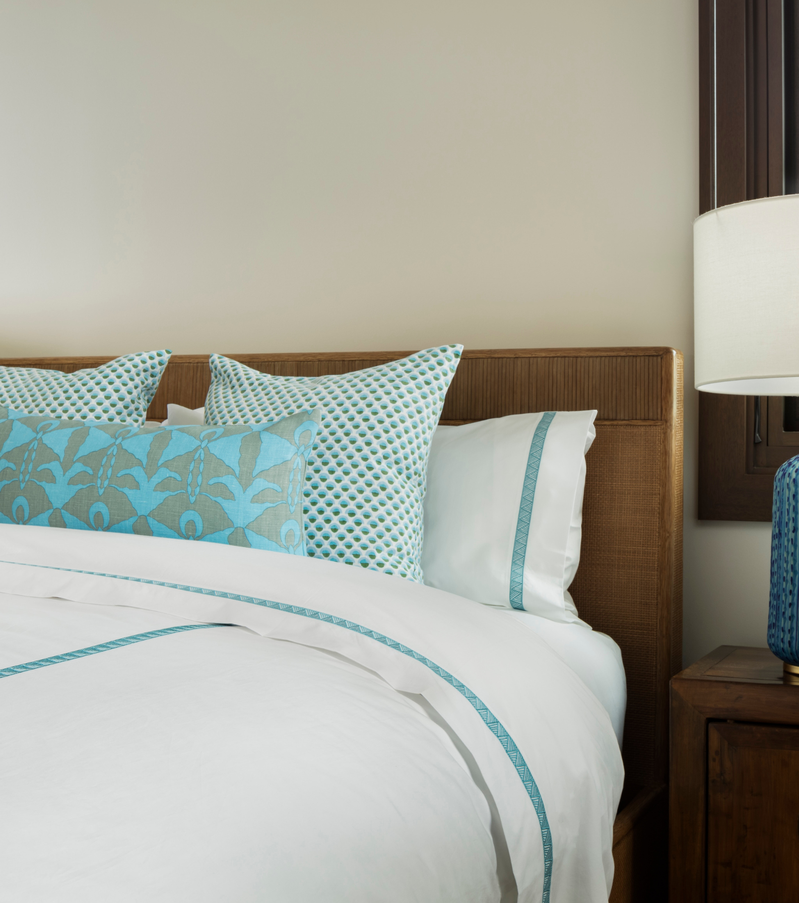 Averylily Weave Duvet Cover in White with embroidered trim in Sky Blue. 510-thread count cotton percale. Styled with Serena Dugan Studio decorative pillows.
