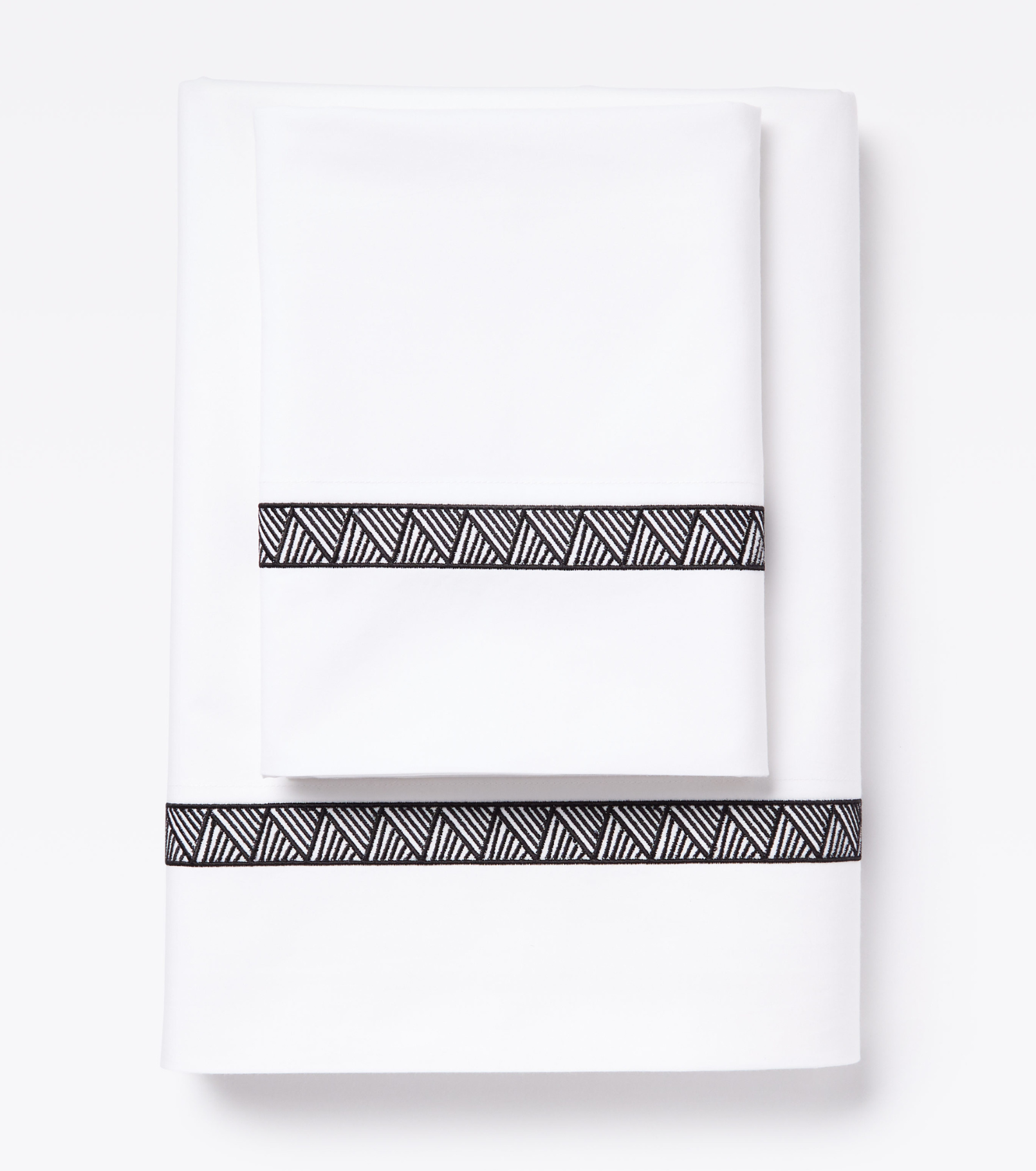 Averylily Weave Sheet Set in White with embroidered trim in Basalt. 510-thread count pure cotton percale.