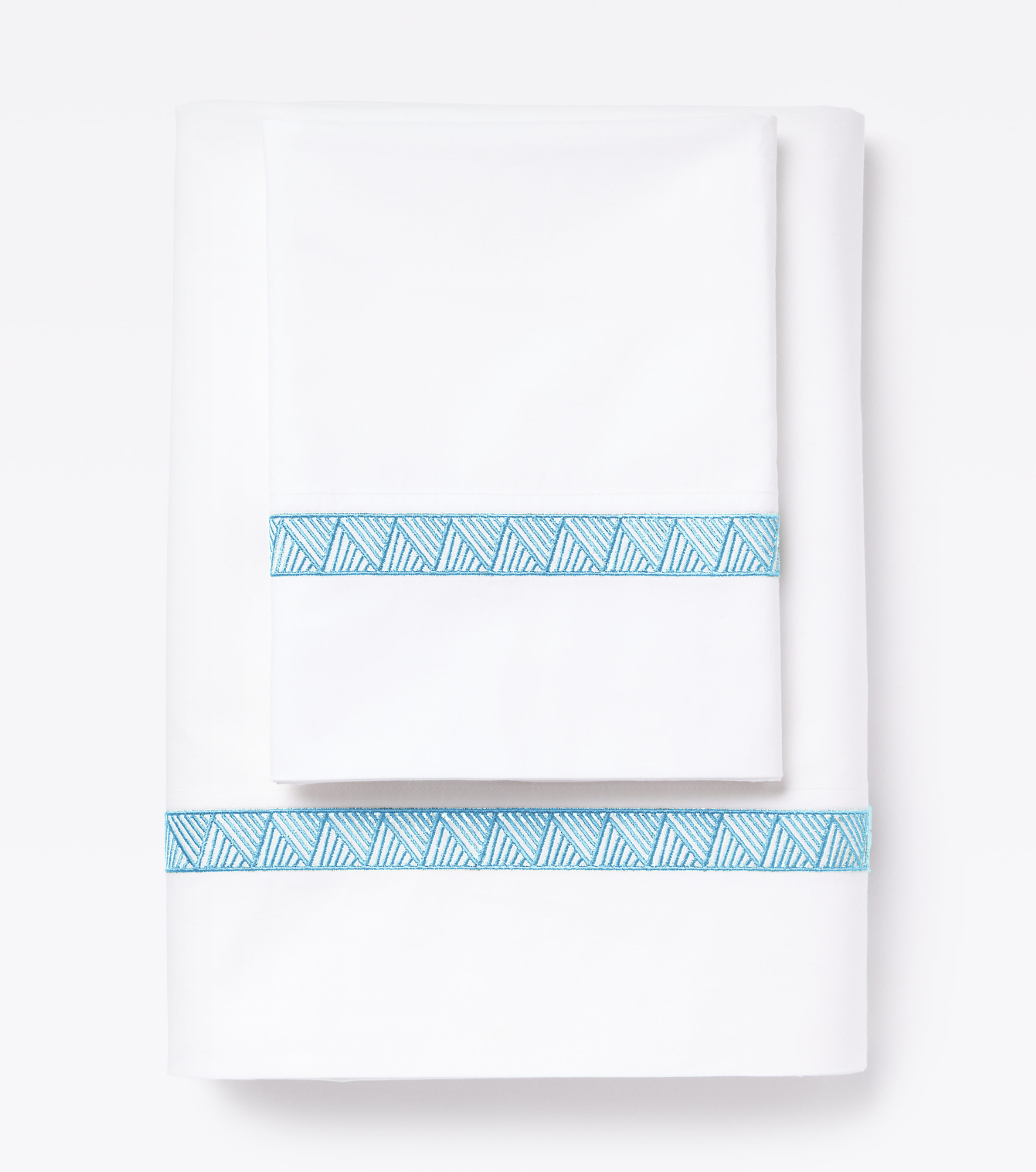 Averylily Weave Sheet Set in White with embroidered trim in Sky Blue. 510-thread count pure cotton percale.